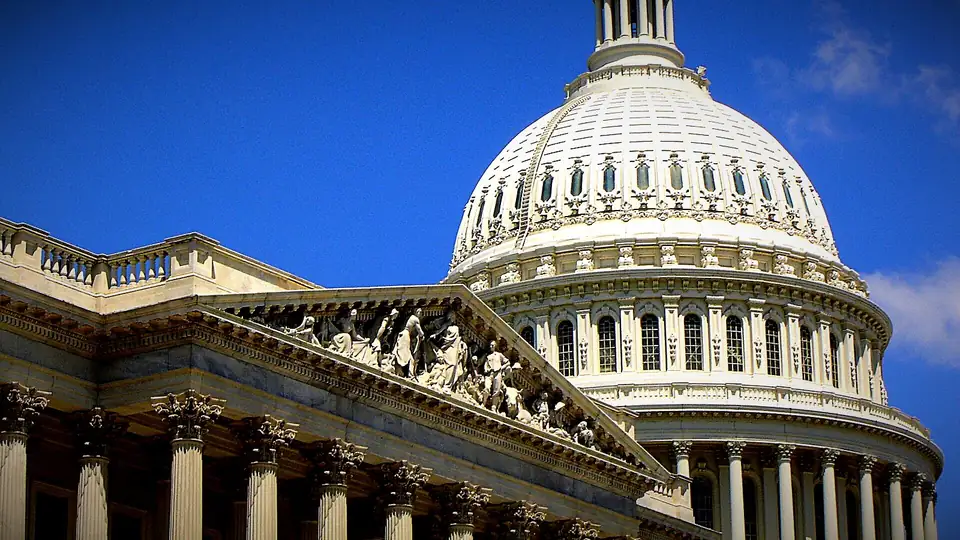 U.S. Capitol dome with blue sky and clouds